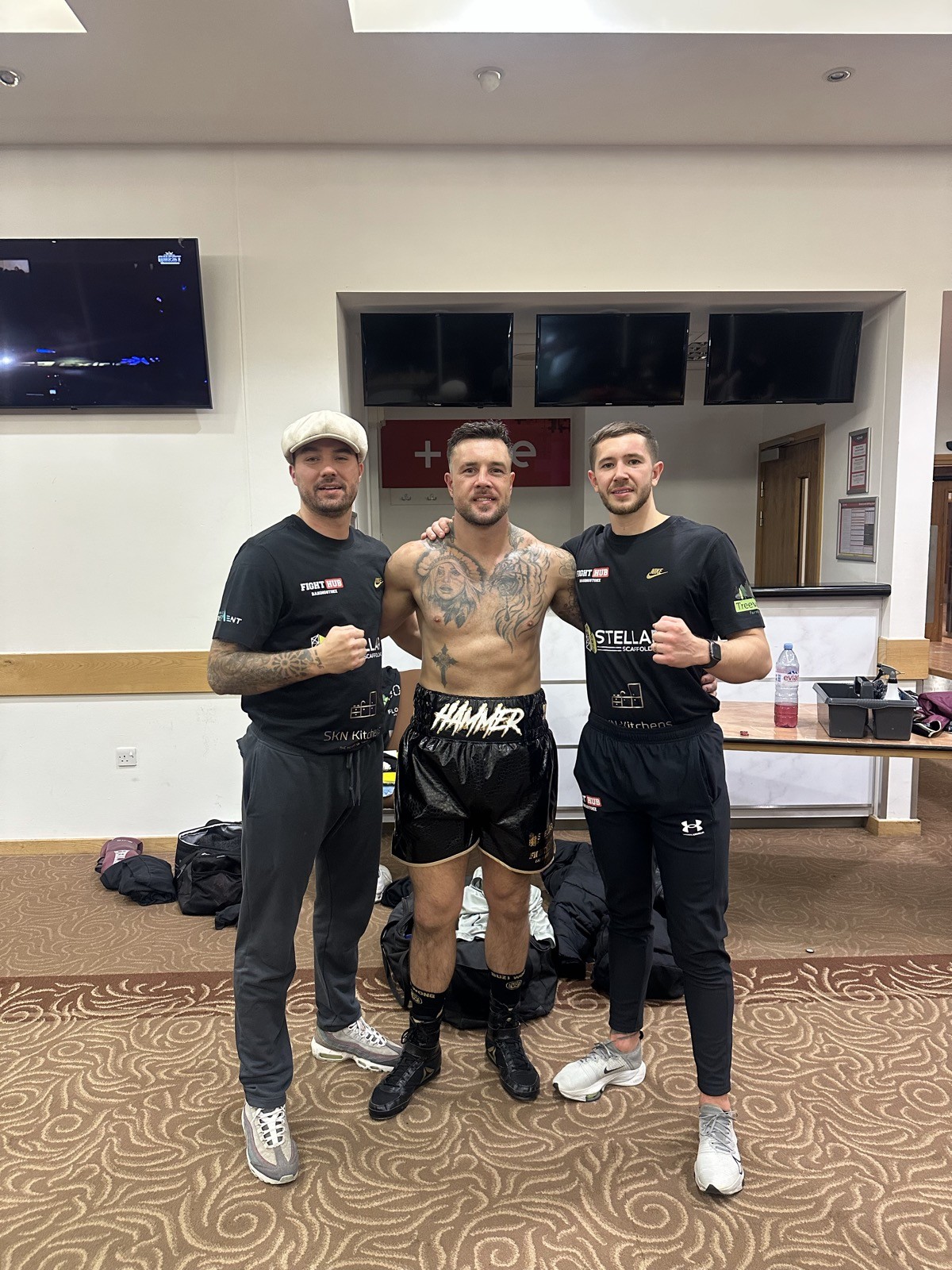 Fighter with coaches after a bout