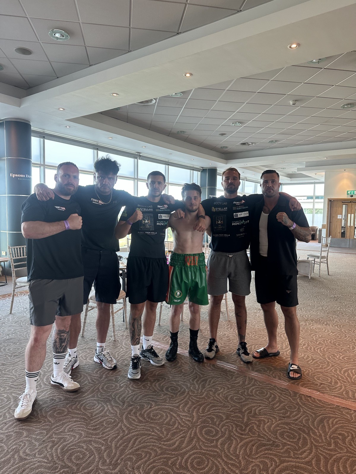 Fighter and team after a competition