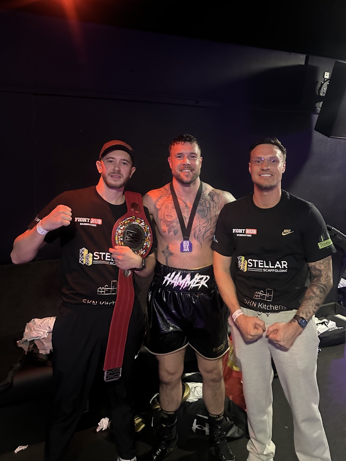 Fighter celebrating a title win with coaches