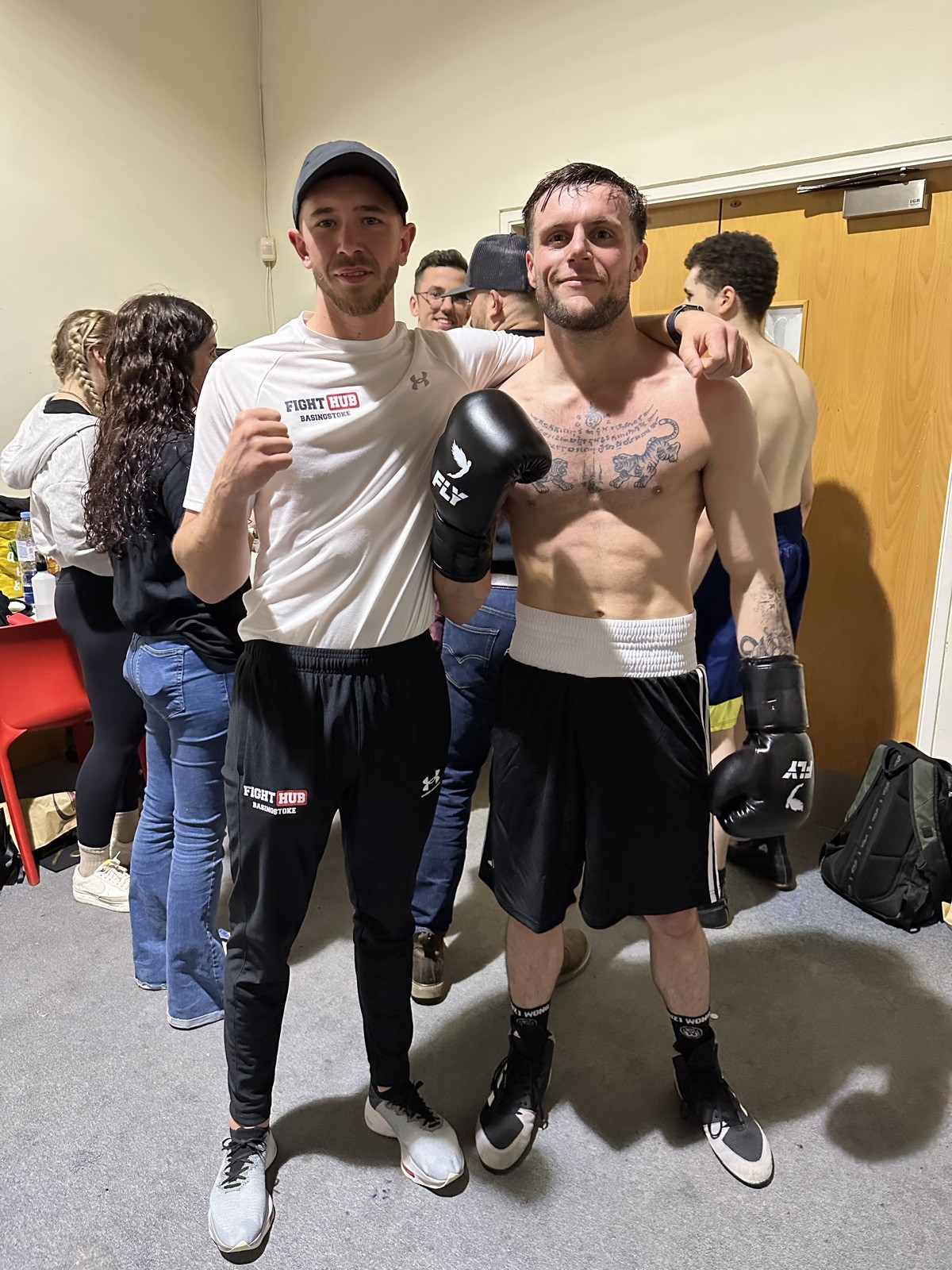 Fighter and coach after a bout